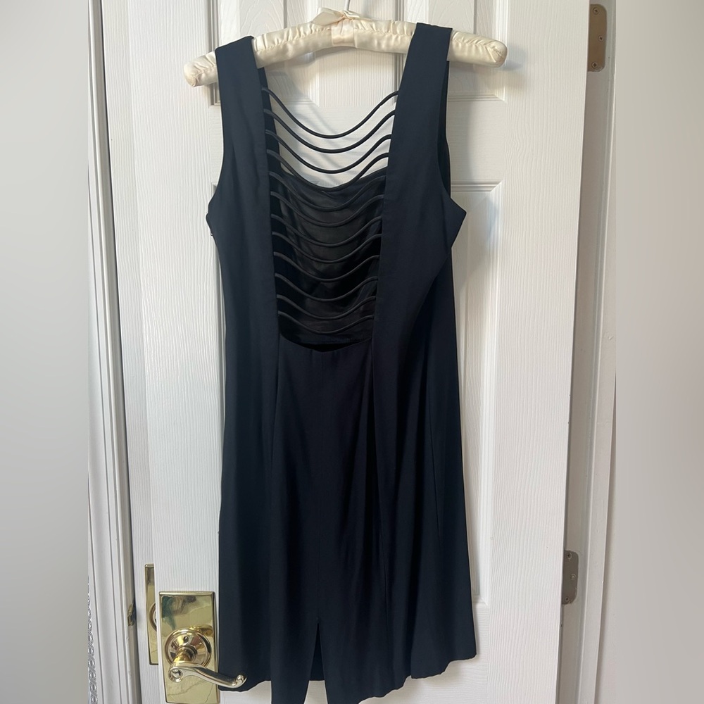 Randm Nights Elegant Black Sleeveless Dress with Sexy Detailed Strapping Back.